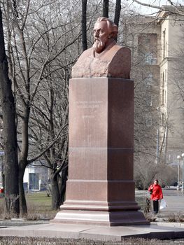 Moscow, Russia - March 27, 2010: Spring day. Peoples walks near monument of Konstantin Tsiolkovsky in Petrovski park. Moscow, Russia