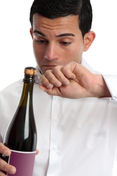 Closeup of a man or bartender holding and opening a bottle of wine or champagne.  White background.