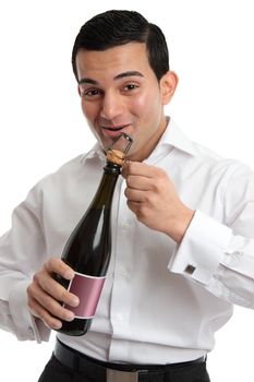 Happy man or waiter opening a bottle of alcohol, wine or champagne for a celebration or special occasion.