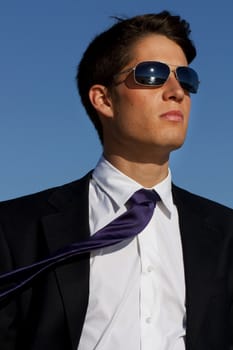 Close up view of a business man with glasses.
