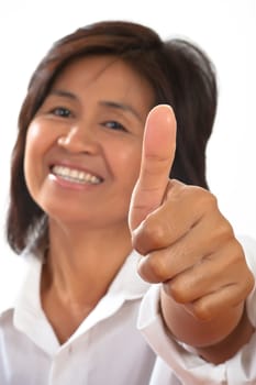 isolated portrait of a young, attractive and happy woman is smiling and shows the thumb