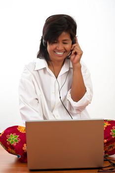 portrait of a happy smiling young Asian woman with a notebook on the floor