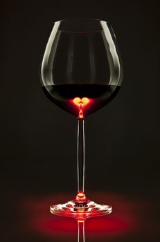 Glass of red wine with a heart inside