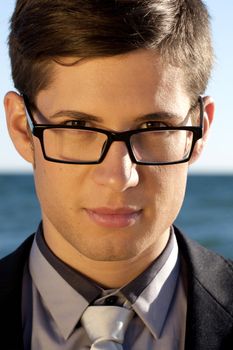 Close up view of a business man with glasses.