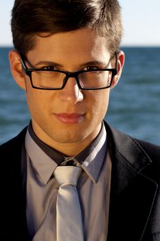 Close up view of a business man with glasses.