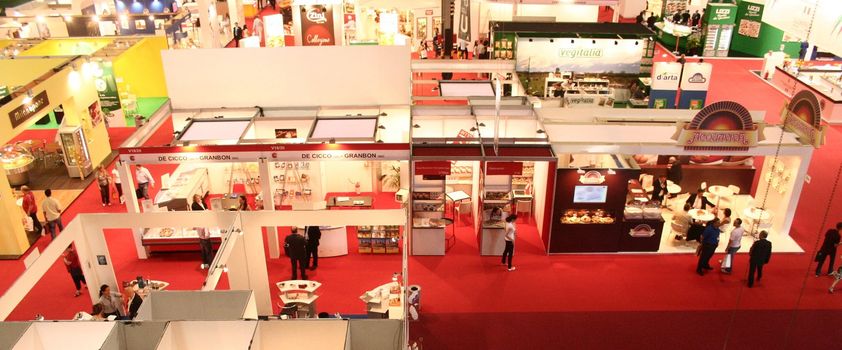 Visiting international and Italian regional food products stands at Tuttofood, World Food Exhibition in Milan, Italy.