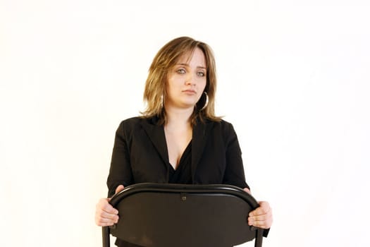 buziness woman sitting on a metallic chair