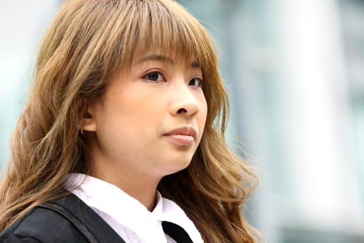 Young attractive business woman in corridor of modern building in outdoor. 