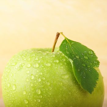 green apple on wood with copyspace showing healthy food concept