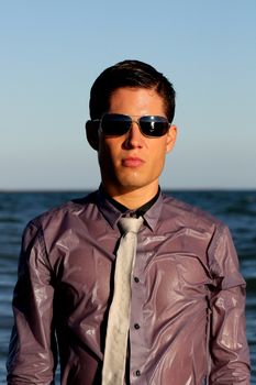 Fully dressed business man on the water .