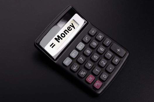 money word on calculator showing financial investment banking or savings concept