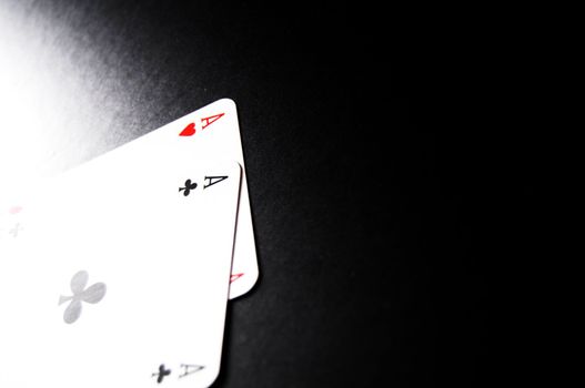 winning concept with four aces on black background