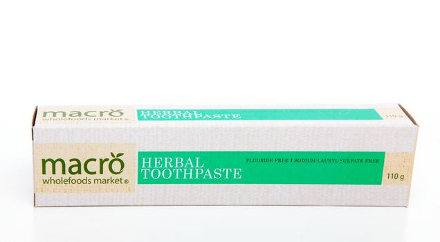 Macro Herbal Toothpaste which contains no fluoride and is free of sodium lauryl sulphates.  White background.  Editorial Use Only.