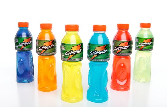 Bottles of Gatorade sports energy isotonic drink contains electrolytes and carbohydrates to rehydrate lost fluids and refuel muscles.  White background.  Flavours are: Fierce Grape, Orange Ice, Lemon-Lime, Blue Bolt, Tropical, Lime Storm.   Editorial use only.
