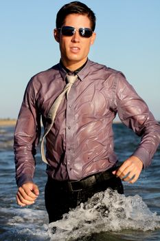 Fully dressed business man on the water .
