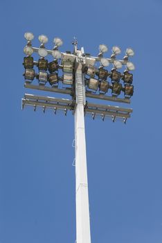 Stadium reflector in a football field at daytime.