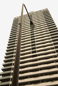 abstract modern residential building pattern with modern light mast foreground, Tokyo, Japan