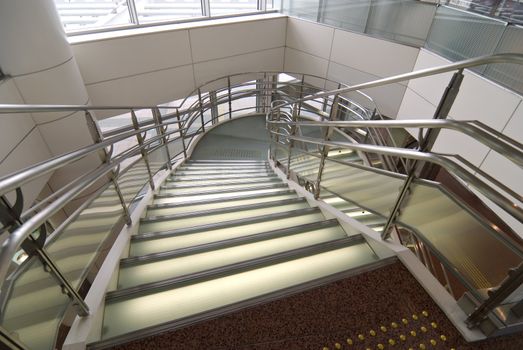 modern stained and matted glass stairs with metallic hand-rails