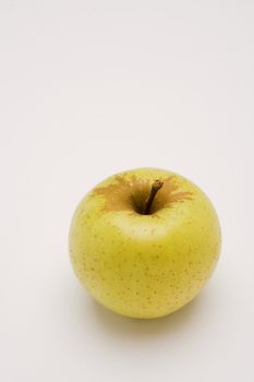 yellow apple over white background