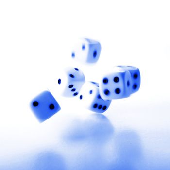 throwing dices in blue showing gambling or winning concept
