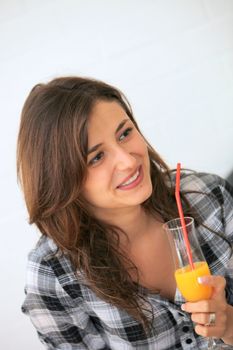young woman drinking cocktail or juice-O-and laughs
