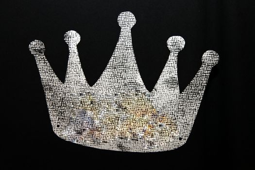 a royal crown on a black ground
