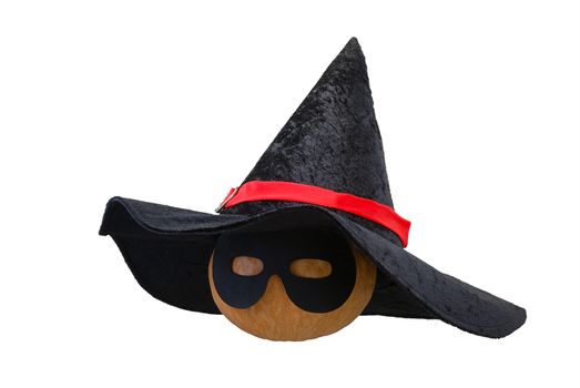 Small Halloween orange pumpkin in black witch hat and  masquerade mask isolated on white background