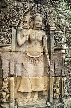 Apsara carved on the wall at bayon, cambodia