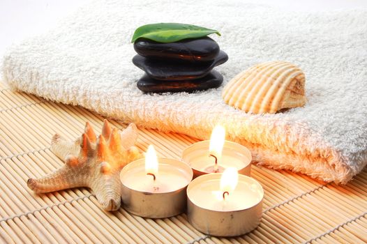 towel and zen stones showing a bath or wellness concept