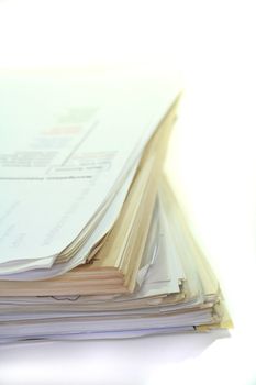 large stack of papers on a white background