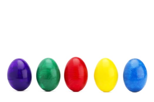 colorful row of easter eggs on white background