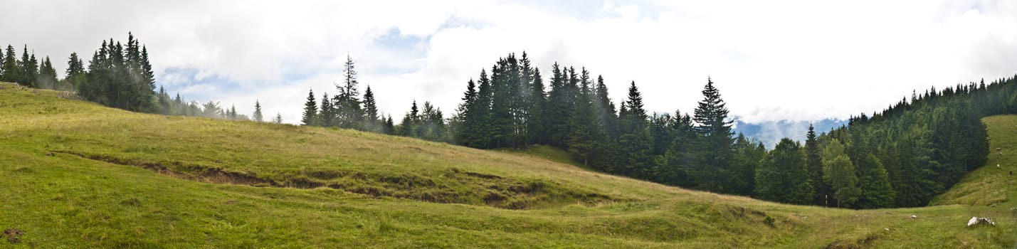 Panorama background in Carpathians. Beautiful mountains and landscape in Romania.