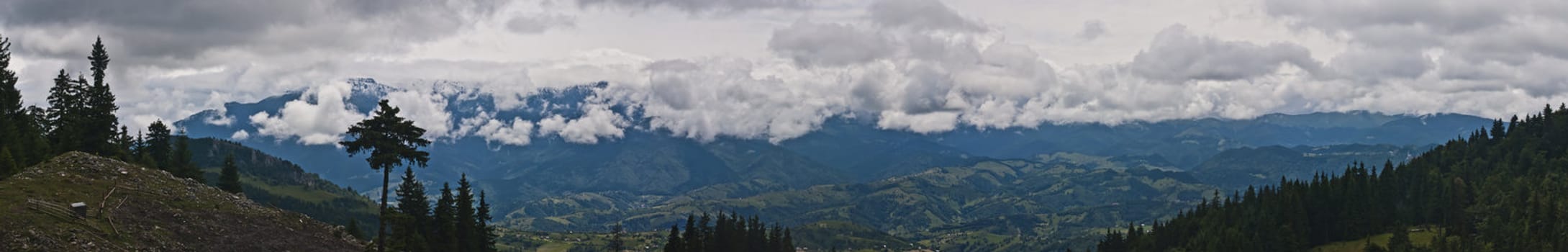 Panorama background in Carpathians. Beautiful mountains and landscape in Romania.