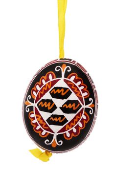 black hanging hand painted easter egg on white background