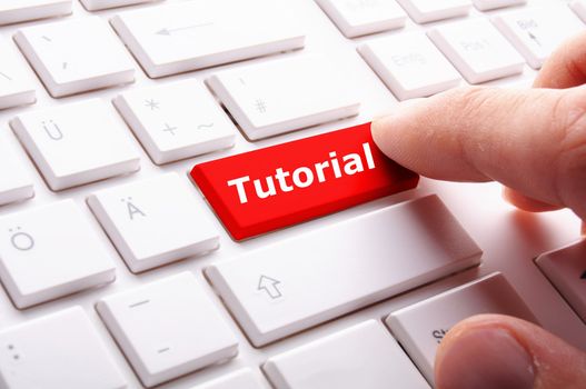 tutorial key with word showing internet or online software education concept