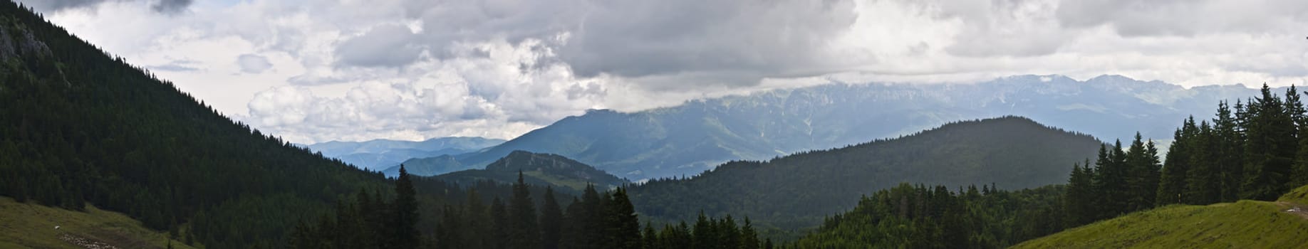 Panorama background in Carpathians. Beautiful mountains and landscape in Romania.