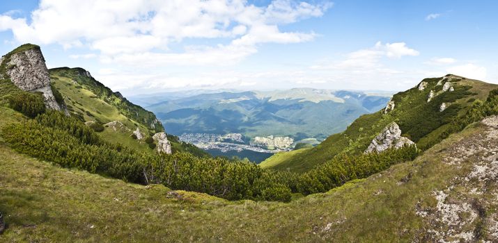 Panorama background in Carpathians. Beautiful mountains and landscape in Romania.