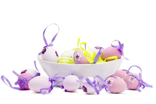 small tender pastel easter eggs in a white bowl white background