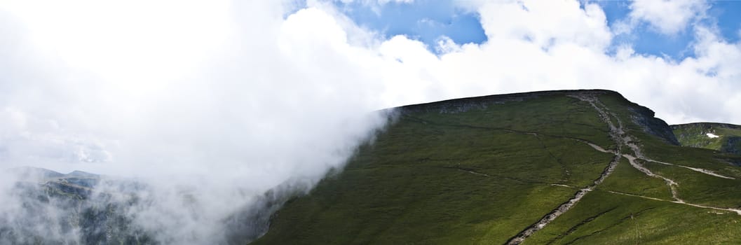 Panorama background in Carpathians. Beautiful mountains and landscape in Romania.