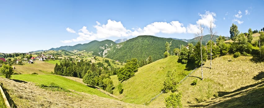 Panorama background in Carpathians. Beautiful mountains and landscape in Romania.