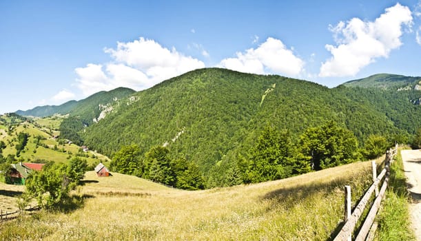 Panorama background in Carpathians. Beautiful mountains and landscape in Romania.