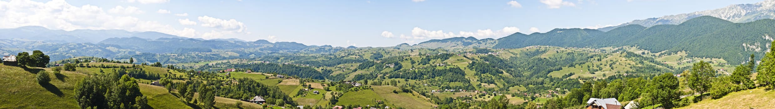 Panorama background in Carpathians. Beautiful mountains and landscape in Romania.