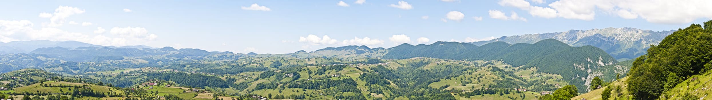 Panorama background in Carpathians. Beautiful mountains and landscape in Romania.