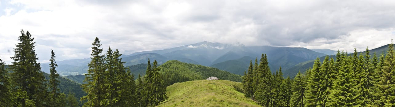 Panorama background in Carpathians. Beautiful mountains and landscape in Romania.