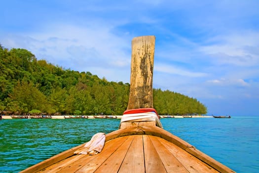 Longtailboat heading towards a beautiful island in Krabi, Thailand
