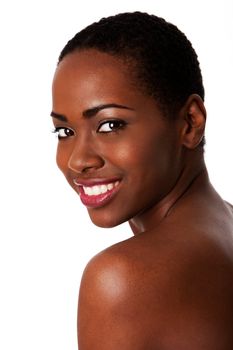 Beautiful happy smiling inspiring African woman with short curly hair and great skin showing teeth, isolated.