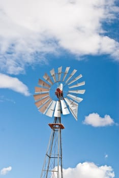 Silver water wheel in Arizona desert