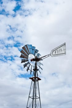 Silver wheel against cloudy sky