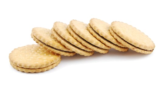 row of chocolate cookies isolated on white background