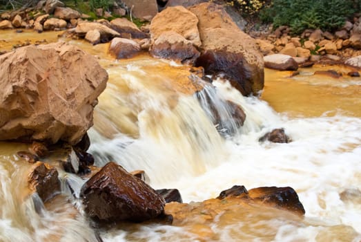 Yellow river in Colorado mountains